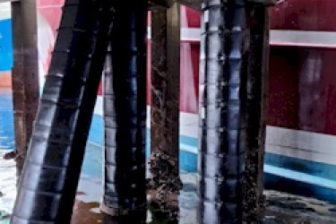 Photo showing Jetty piles including raker pile with HCL Pile Wrap System